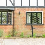 Outside view of timber windows with black frames