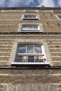 sash windows on a brick townhouse