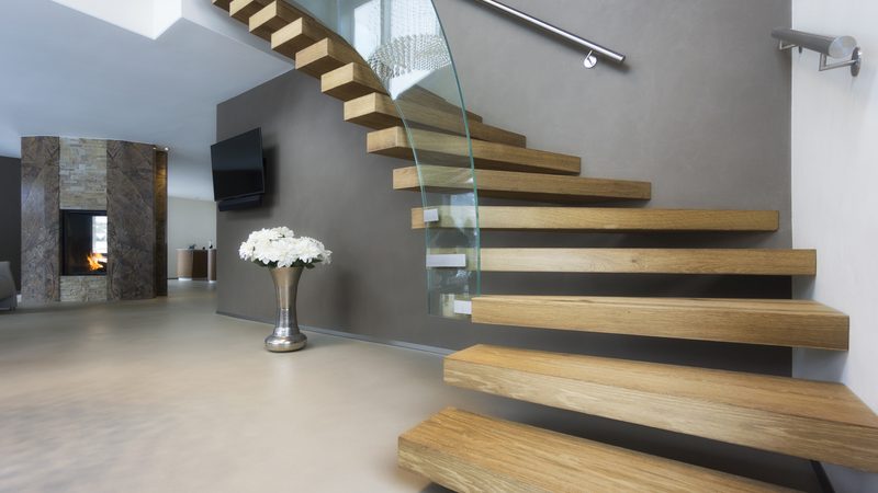 Bespoke Curved Staircase with wooden steps and a glass side panel